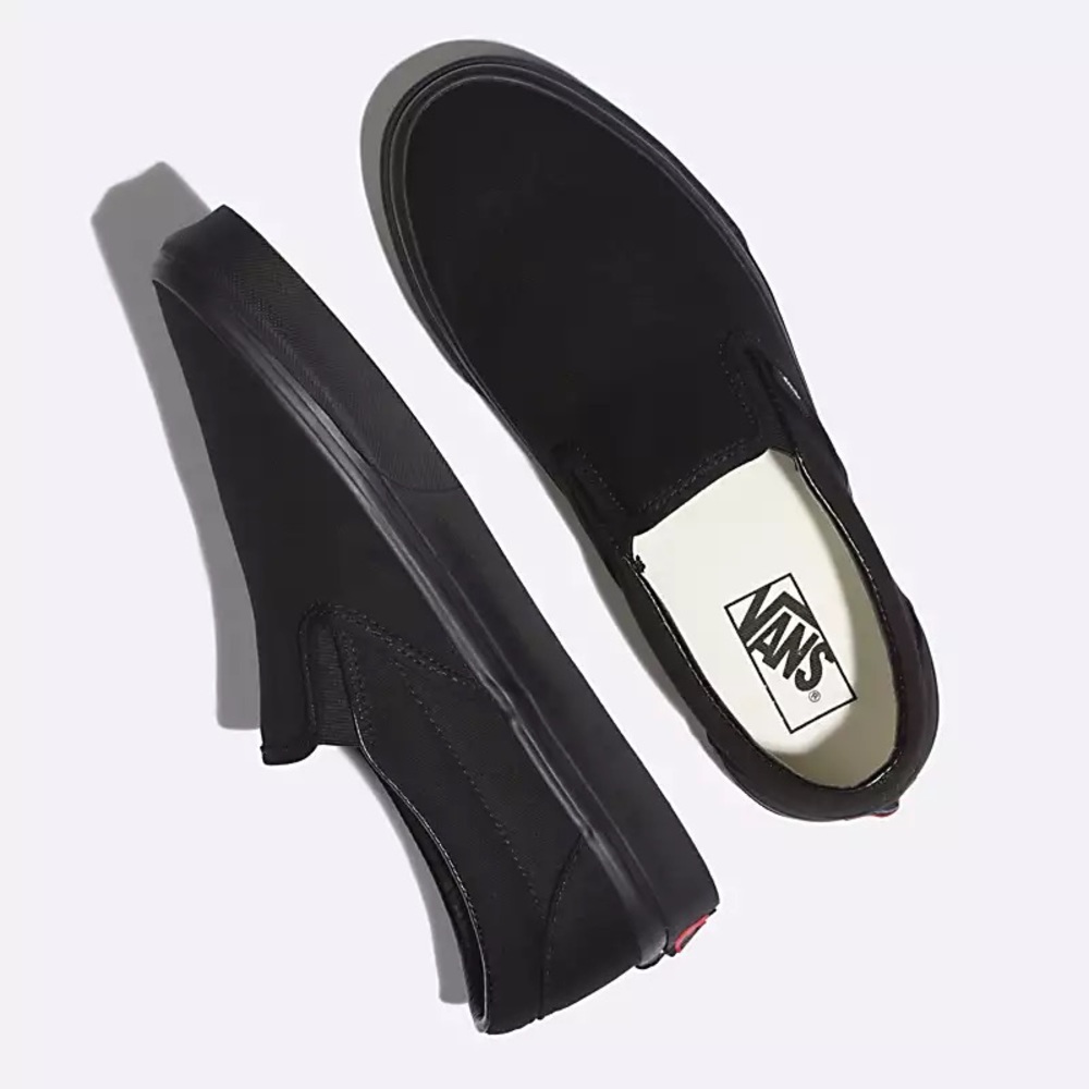 all black slip on vans